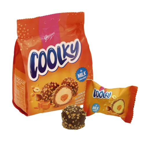 Coolky Milk Waffelkugeln mit Keksgeschmack-Creme (48%) und Karamell-Kern (8,7%) in Milchschokolade (25%) und Zucker-Haselnuss-Streuseln (10%).